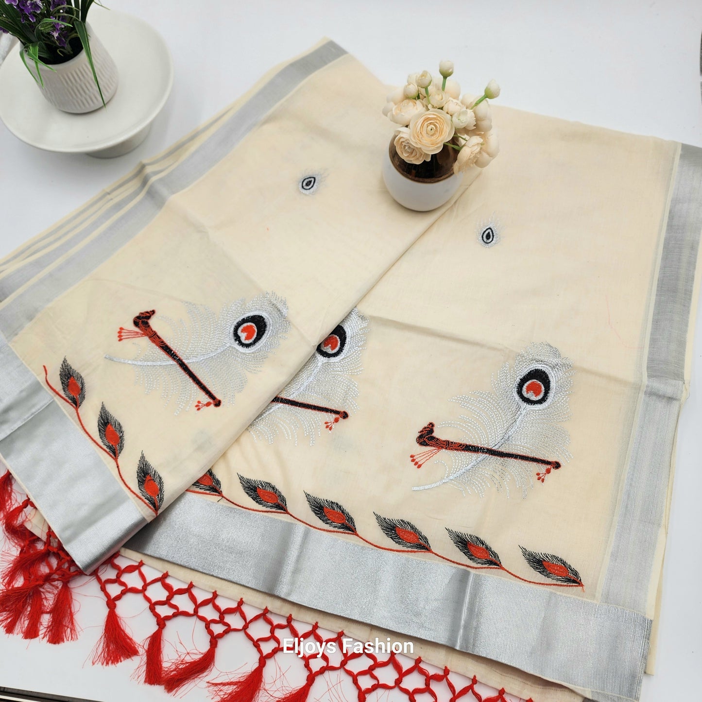 Tissue Silk Saree in beautiful peacock and covert design in Red, black and silver color Combination