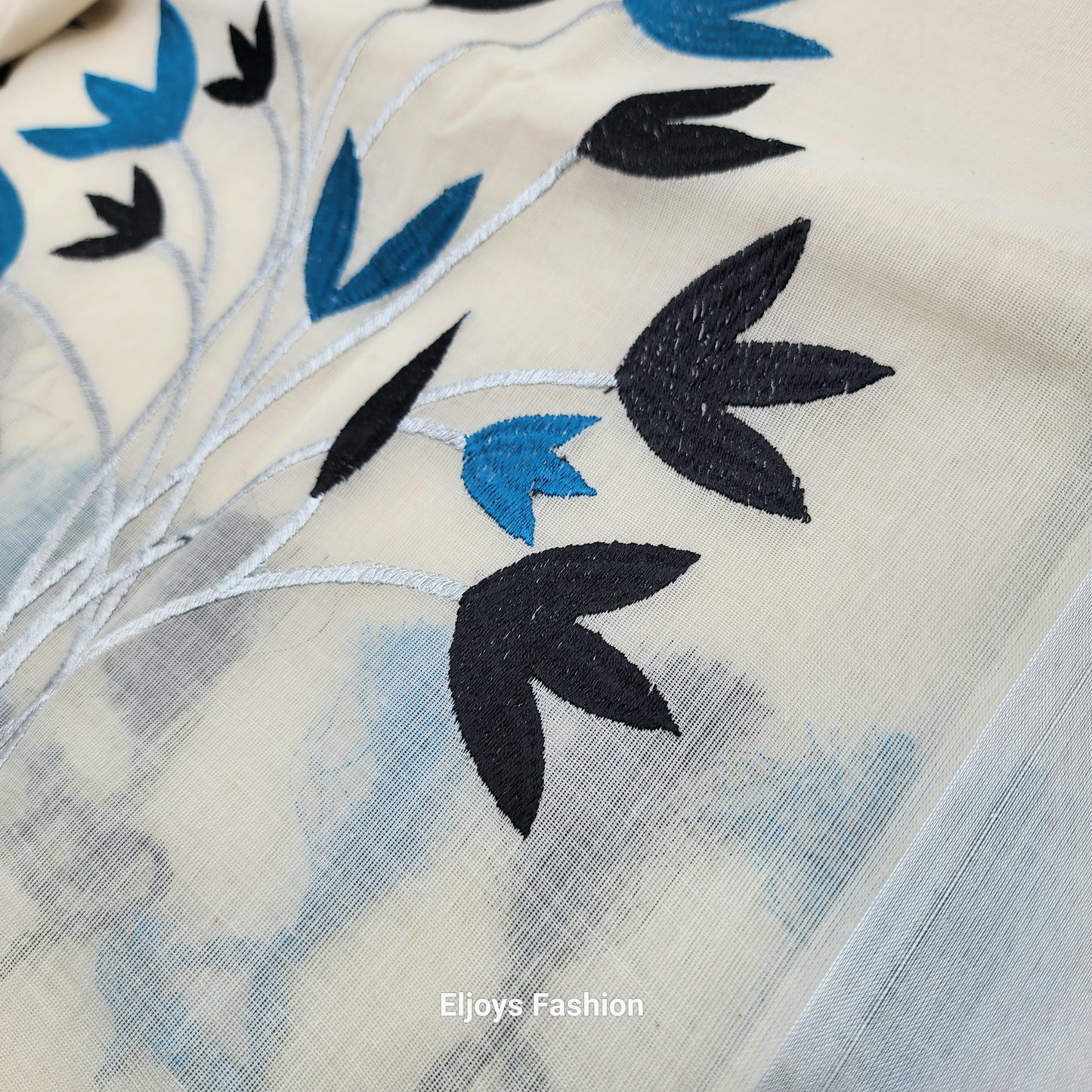 Tissue Silk Saree featuring Silver, Blue and Black floral design with Silver border.