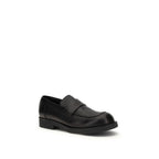 MM6 black calf leather Bos Taurus slip-on loafers with sleek design and rounded toes, perfect for casual or formal wear.