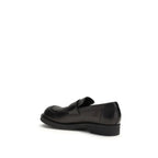 MM6 black calf leather Bos Taurus slip-on loafers with sleek design and rounded toes, stylish footwear for casual or formal wear.