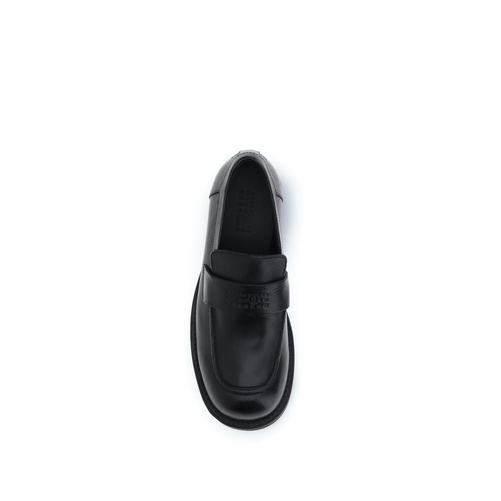 MM6 black calf leather Bos Taurus slip-on loafers displayed on a clean background.