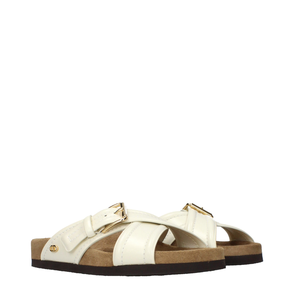 Beige leather slippers by Valentino Garavani featuring a sleek, minimalist design and comfortable slip-on style.