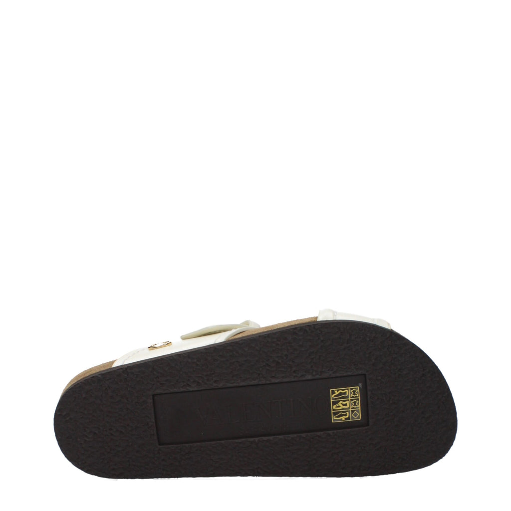 Beige leather slippers by Valentino Garavani, stylish and comfortable footwear with a sleek design and subtle branding.