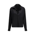 Tom Ford black silk dress shirt displayed on a hanger, showcasing its smooth fabric and classic design.