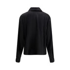 Tom Ford black silk dress shirt with a classic collar and button-front, displayed on a hanger.