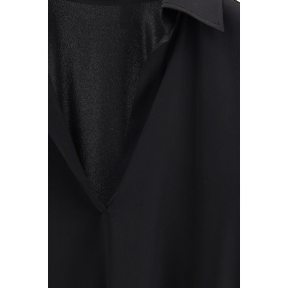Tom Ford black silk dress shirt with a classic collar and button-front, displayed on a hanger.