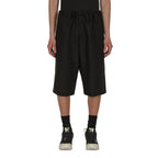 Maison Margiela black linen Bermuda shorts with a relaxed fit, featuring a mid-rise waist and classic knee-length design.