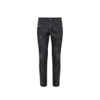 Black cotton skinny jeans by Dsquared² with classic five-pocket design and slim fit, displayed on a model.