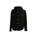 Black denim shirt by Palm Angels featuring a classic fit and stylish design, displayed on a hanger.