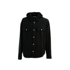 Black denim shirt by Palm Angels featuring a classic fit and stylish design, displayed on a hanger.