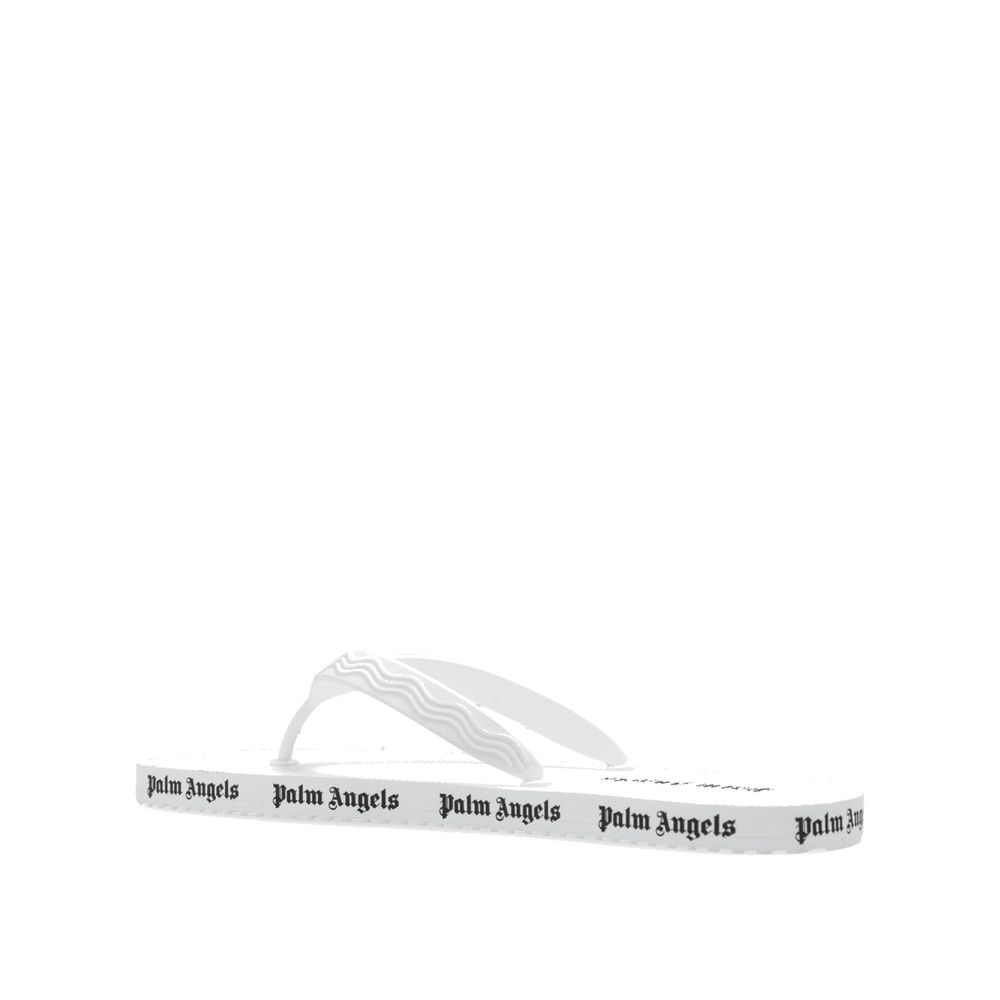 White rubber slides by Palm Angels featuring a sleek design and open toe for casual summer wear.