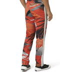 Palm Angels red polyester athletic pants displayed, featuring a sleek sporty design and comfortable fit.