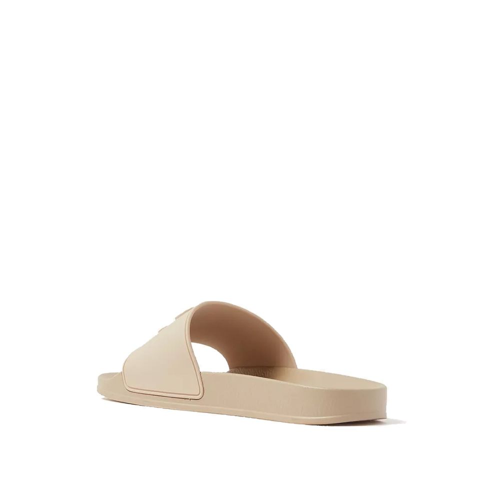 Beige Palm Angels rubber slides featuring wide straps and textured soles, designed for casual comfort and style.