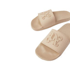 Beige rubber slides by Palm Angels featuring a sleek design and open toe for comfortable casual wear.