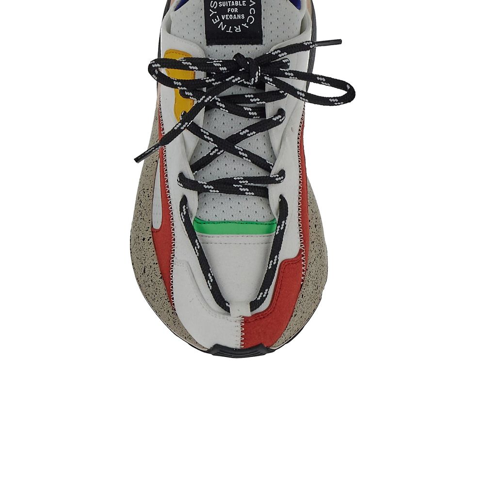Stella McCartney white vegan leather chunky sneakers with thick soles and minimal design on a plain background.