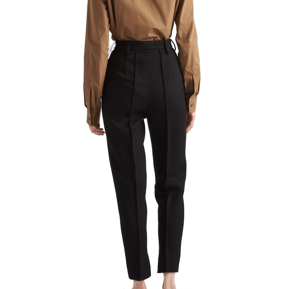 Prada black virgin wool dress pants with tailored fit and classic style, featuring a smooth waistband and sleek fabric.