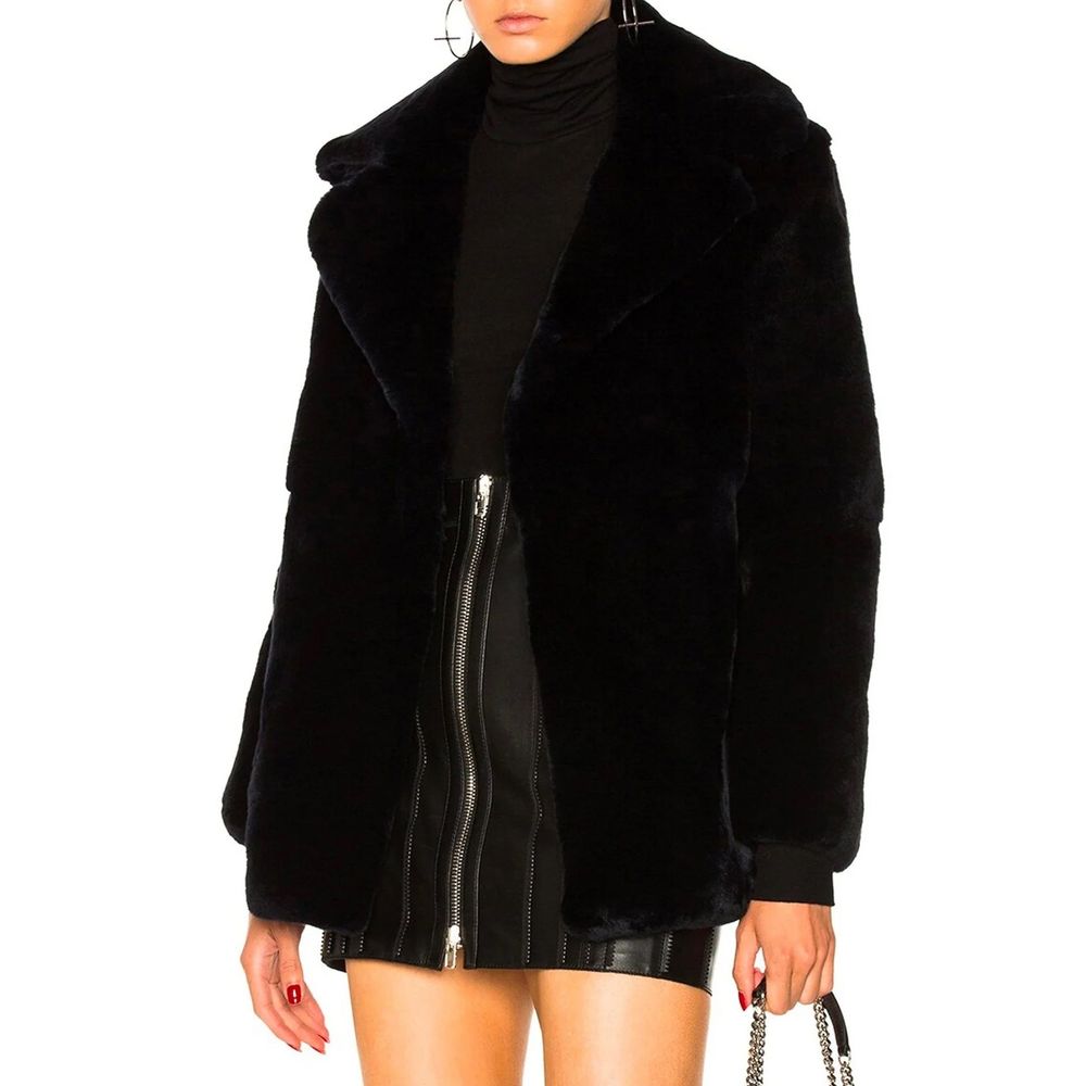 Alberta Ferretti blue rabbit fur full-length jacket displayed on a hanger with a plush, luxurious appearance and detailed fur texture.