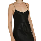 Saint Laurent black acetate casual dress displayed on a hanger, featuring sleek design and minimalist style.