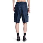 Prada blue linen Bermuda shorts displayed on a model, showcasing a stylish, lightweight summer casual wear look.