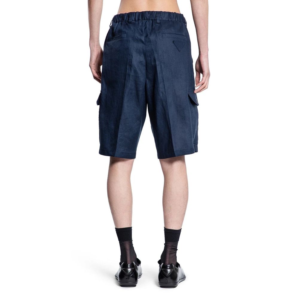 Prada blue linen Bermuda shorts displayed on a model, showcasing a stylish, lightweight summer casual wear look.