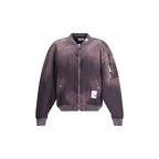 Black rayon bomber jacket by Maison Mihara Yasuhiro featuring a sleek design and ribbed cuffs, displayed on a hanger.