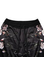 Black floral straight-leg chino trousers by Dolce & Gabbana, featuring a tailored fit and floral pattern design.