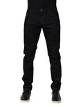 Black floral cotton skinny men's denim jeans by Dolce & Gabbana with detailed floral print and classic five-pocket design.