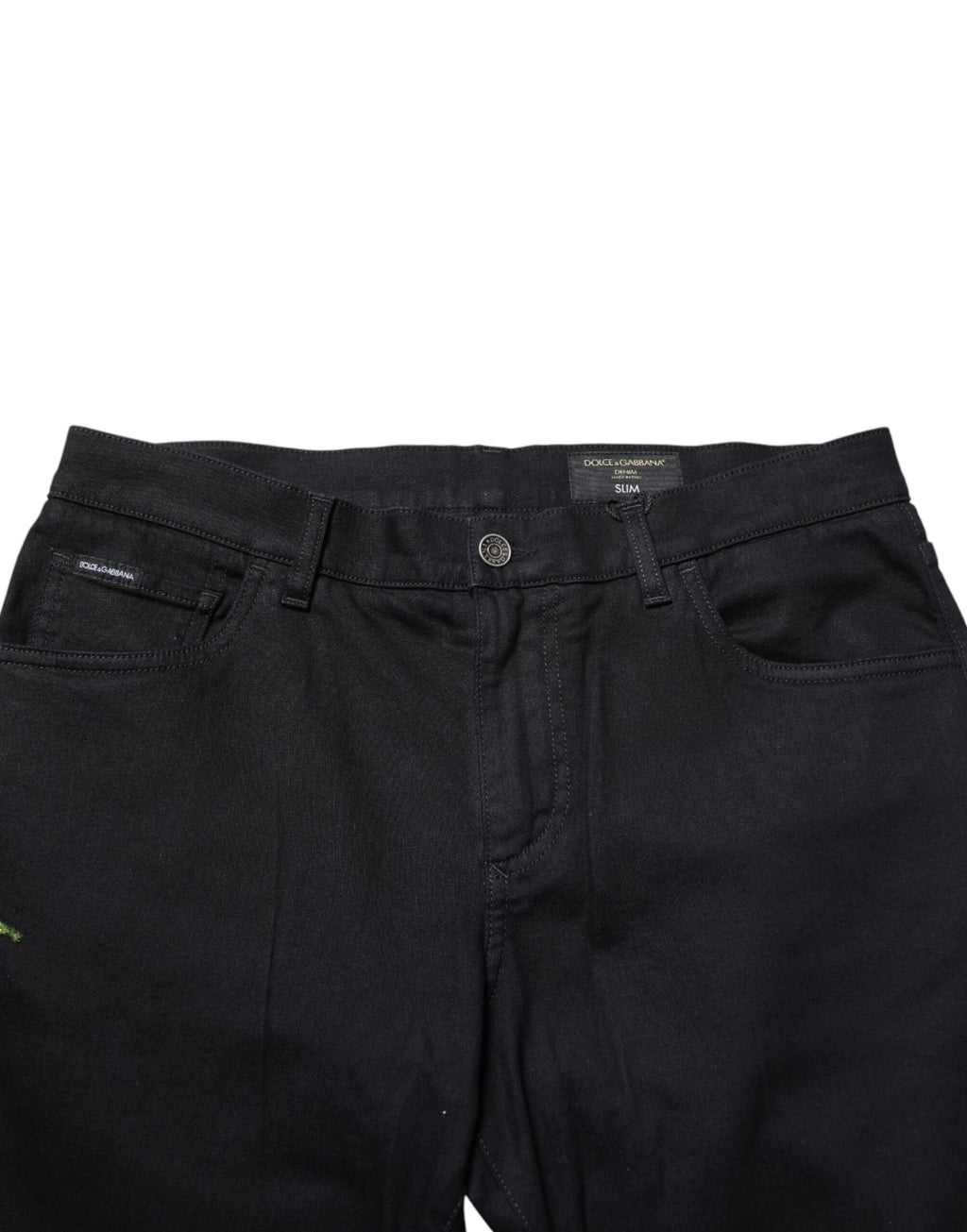 Black floral cotton skinny men's denim jeans by Dolce & Gabbana, showing close-up of floral pattern and fitted style.