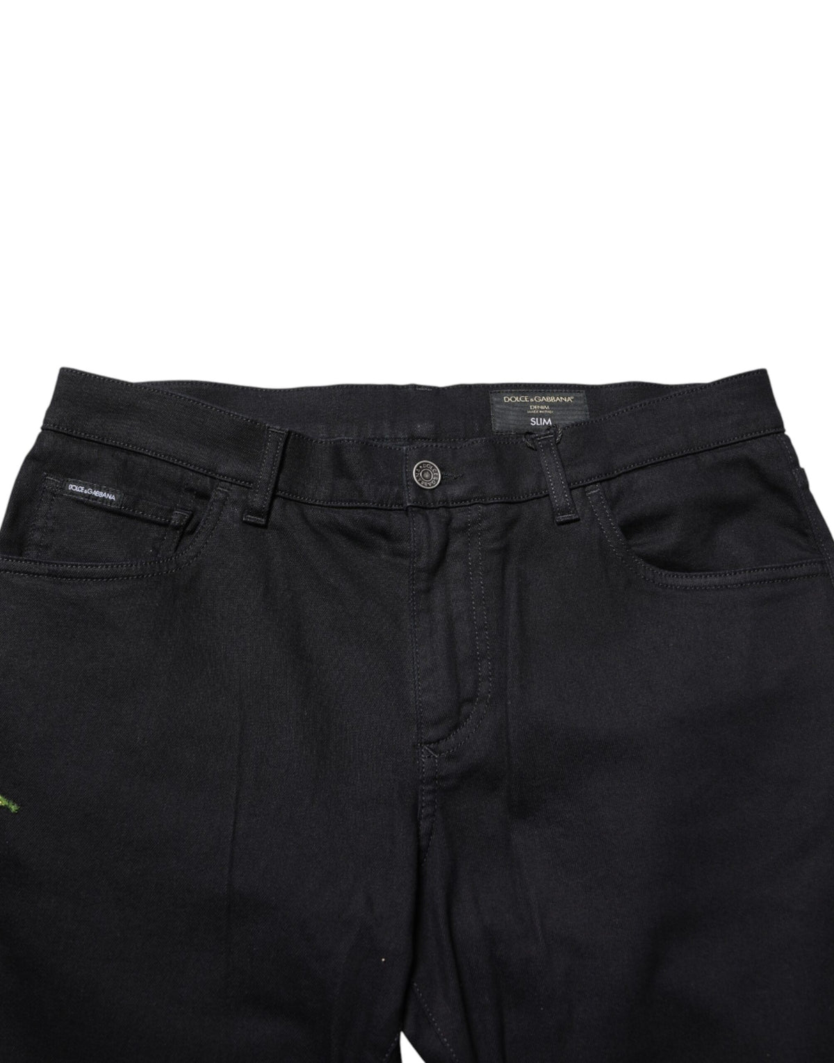 Black floral cotton skinny men's denim jeans by Dolce & Gabbana, showing close-up of floral pattern and fitted style.