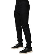 Black floral cotton denim skinny jeans for men by Dolce & Gabbana, featuring a fitted style and floral pattern.