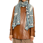 Lanvin blue wool scarf draped over a neutral background, showcasing soft texture and elegant design.