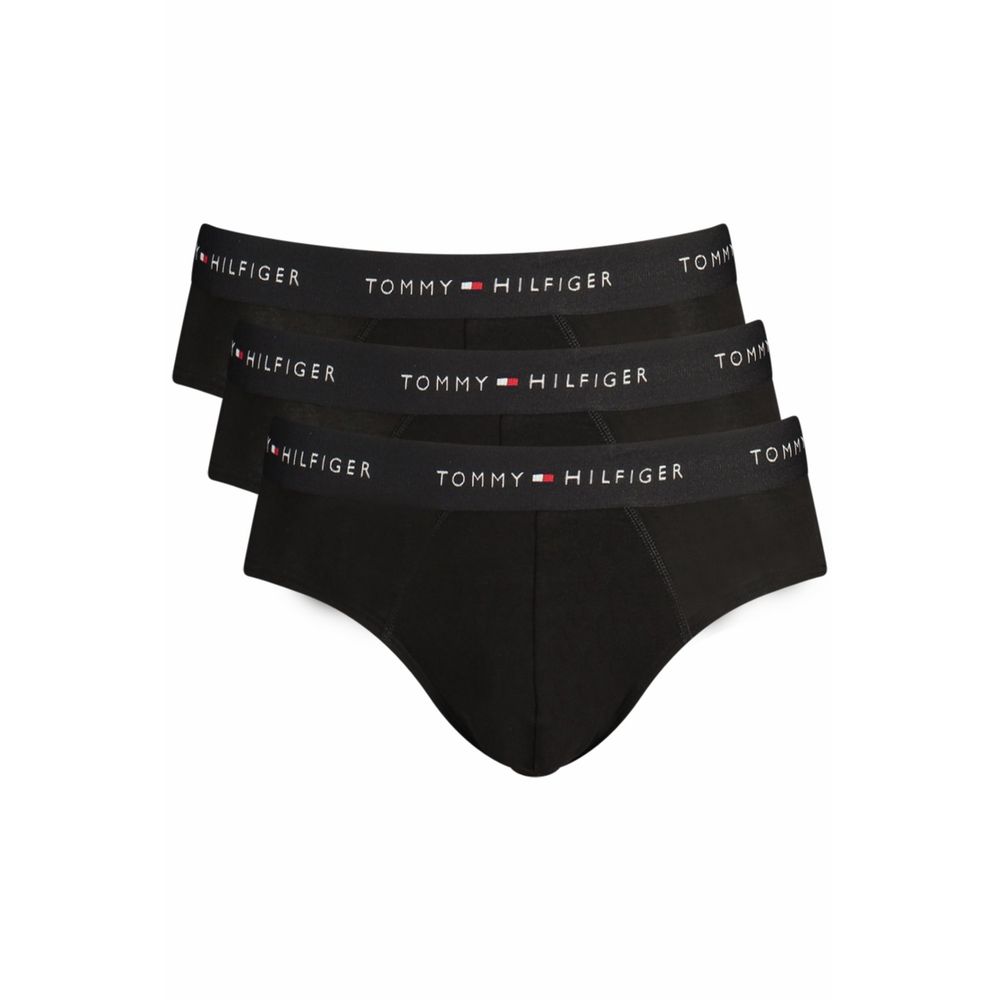 Black cotton men's briefs by Tommy Hilfiger with classic fit and waistband logo, shown laid flat.