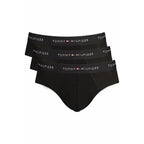 Black cotton men's briefs by Tommy Hilfiger with classic fit and waistband logo, shown laid flat.