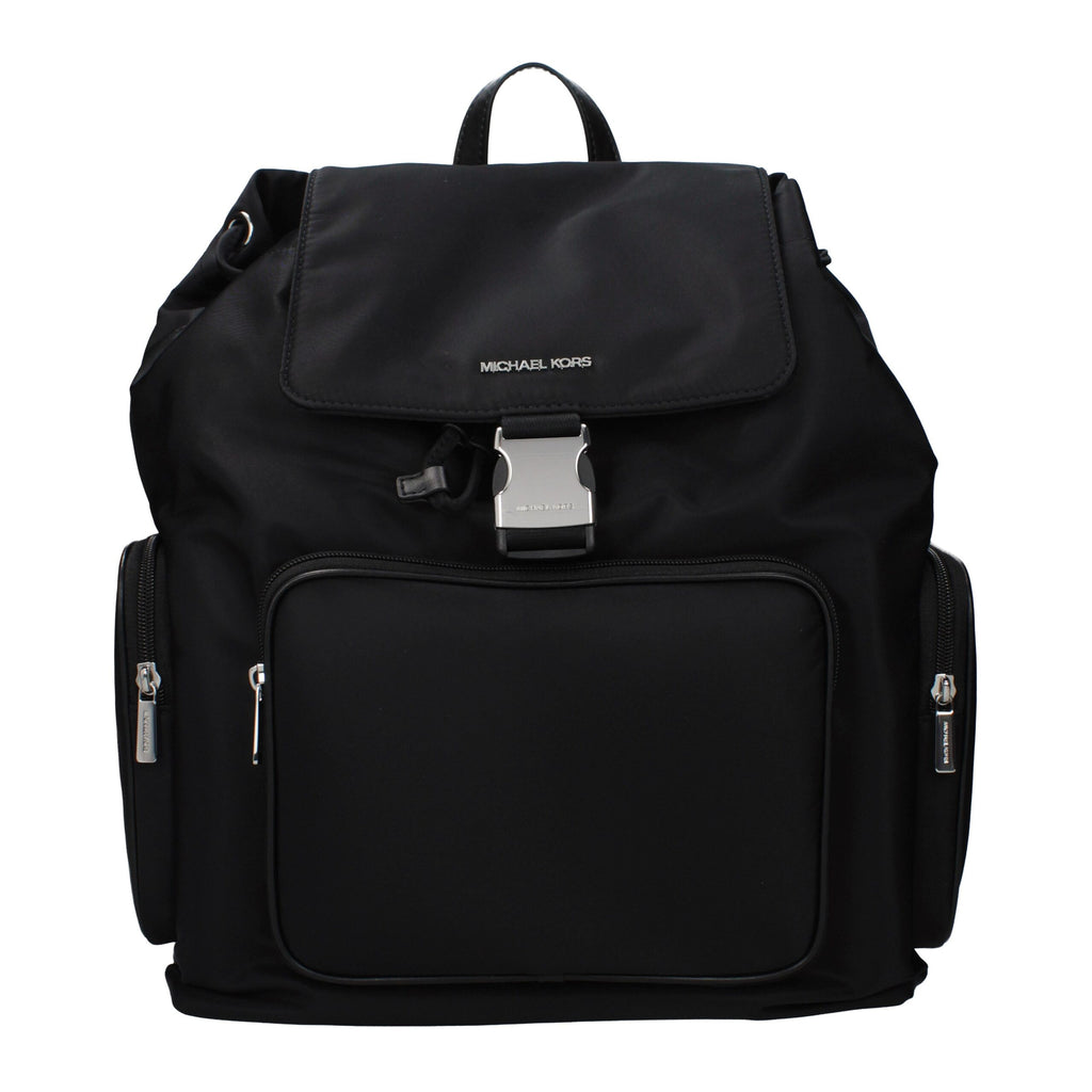 Black fabric Michael Kors backpack with adjustable straps, front zip pocket, and logo detail, designed for stylish everyday use.