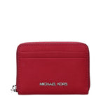 Michael Kors red leather cardholder with multiple card slots and sleek design, displayed on a clean background.