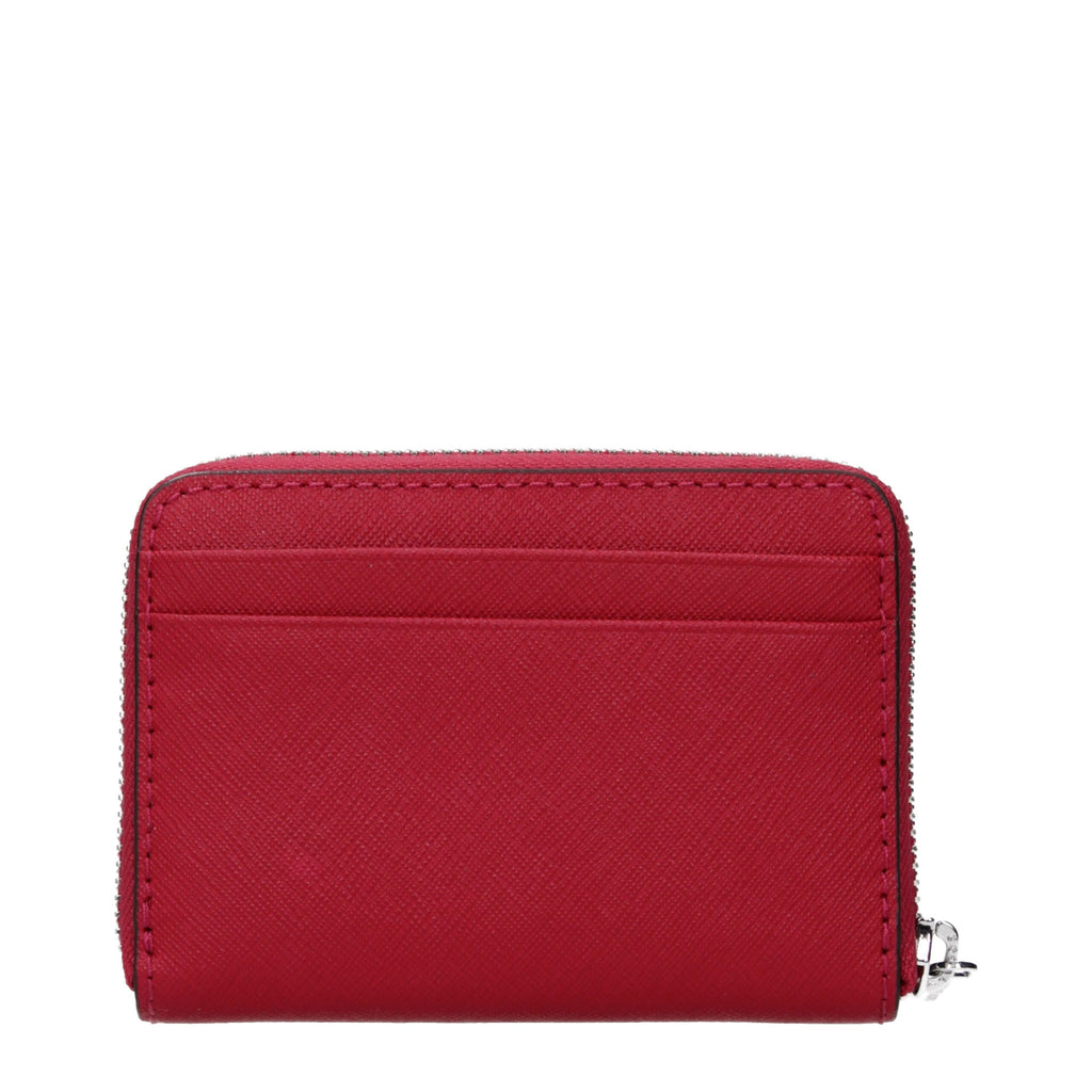 Red leather Michael Kors cardholder with multiple card slots and sleek design for stylish organization.
