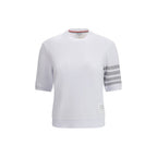 Thom Browne white cotton sportswear with tailored fit and minimalist design, featuring subtle branding and comfortable fabric.