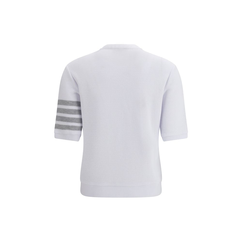Thom Browne white cotton sportswear, casual athletic shirt with brand logo, laid flat on a neutral background.