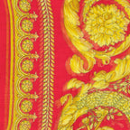 Versace red modal scarf with luxurious fabric and elegant drape, showcasing vibrant color and stylish design.