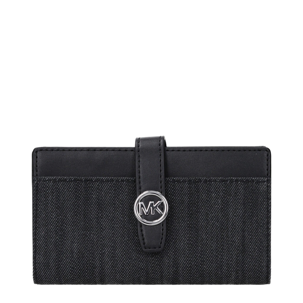 Black fabric wallet by Michael Kors with multiple card slots and zip coin pocket, shown open with interior compartments visible.