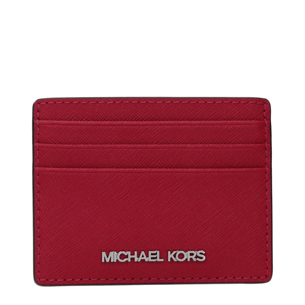 Michael Kors red leather cardholder with multiple card slots and sleek design, featuring the brand logo on the front.