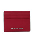Michael Kors red leather cardholder with multiple card slots and sleek design, featuring the brand logo on the front.