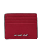 Michael Kors red leather cardholder with multiple card slots and sleek design, featuring the brand logo on the front.