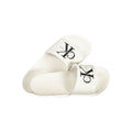 Calvin Klein white polyurethane men's slipper with slip-on design and cushioned sole, ideal for casual indoor wear.
