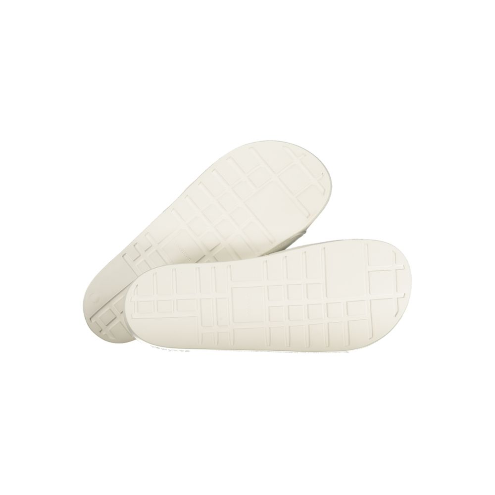 Calvin Klein white polyurethane men's slippers with slip-on design and cushioned soles, suitable for casual indoor wear.