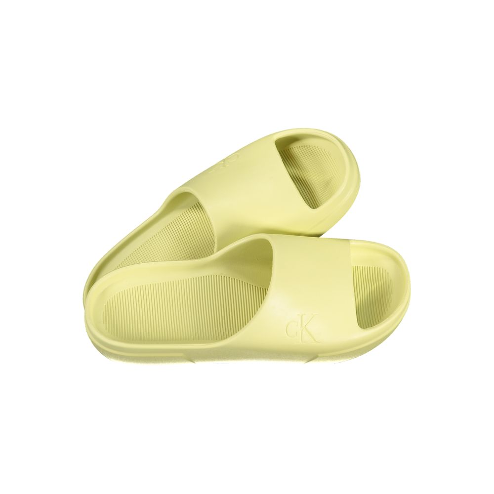 Calvin Klein yellow polyurethane men's slippers with slip-on design and cushioned soles, stylish and comfortable footwear.