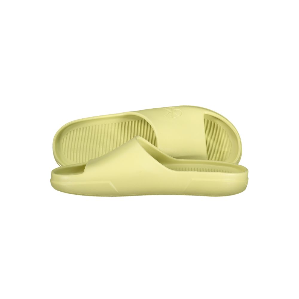 Calvin Klein yellow polyurethane men's slippers with slip-on design and cushioned soles, perfect for casual wear.
