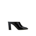 Prada black calfskin mules with pointed toes and low block heels, showcasing sleek and elegant footwear design.