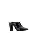 Prada black calfskin mules with pointed toes and sleek design, showcasing elegant slip-on footwear for women.