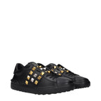 Black leather sneakers from Valentino Garavani featuring sleek design and signature branding.